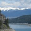 View driving to The Bullet Hole Cabin at Whispering Ridge along the west side of Lake Koocanusa; looking at the Canadian Rockies.